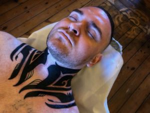 blackwork throat neck tattoo